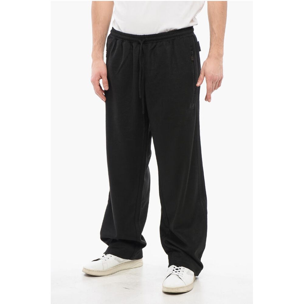 Adidas Joggerji iz volnene Blend z detajli v barvah