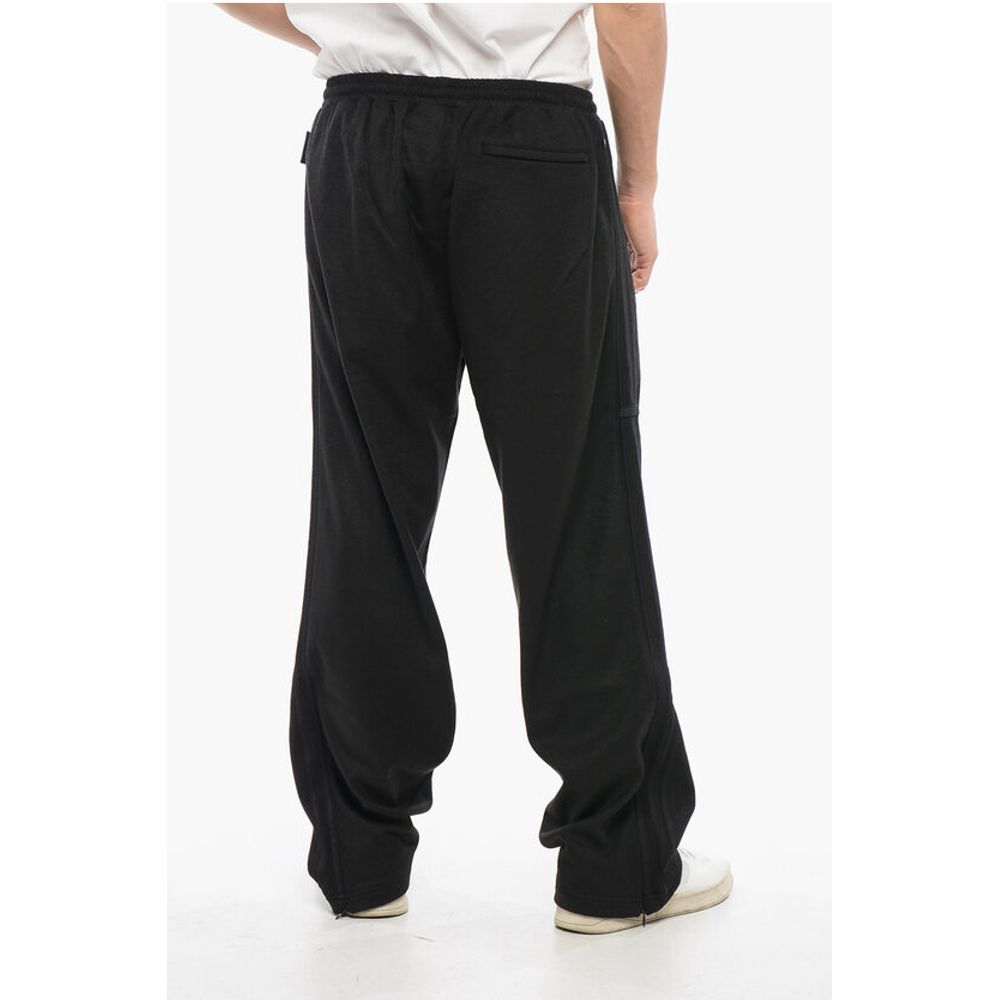 Adidas Joggerji iz volnene Blend z detajli v barvah