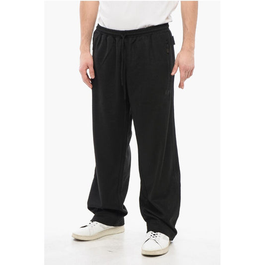 Adidas Joggerji iz volnene Blend z detajli v barvah